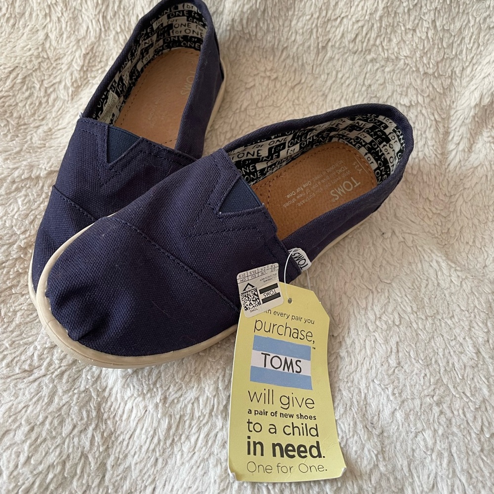 Toms brand new with tags slip on shoes. Size Youth 3.5